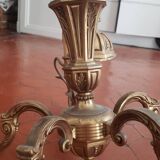 Large old chandelier in gilded brass