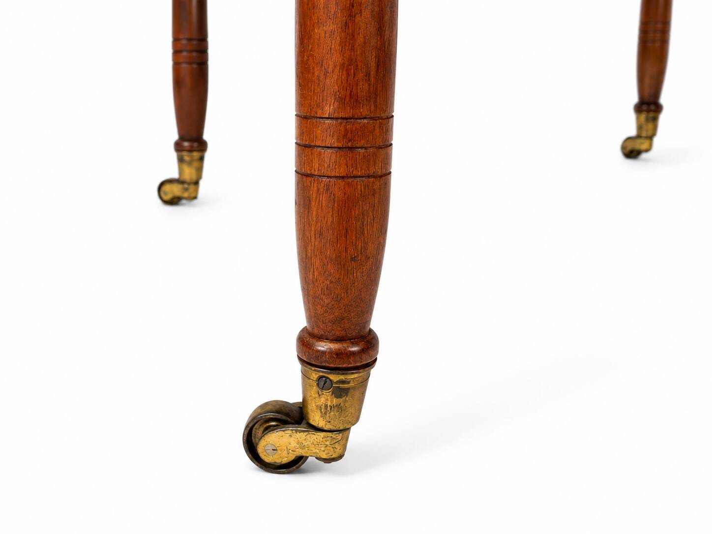 Pair of English mahogany side tables with sliding shelf.