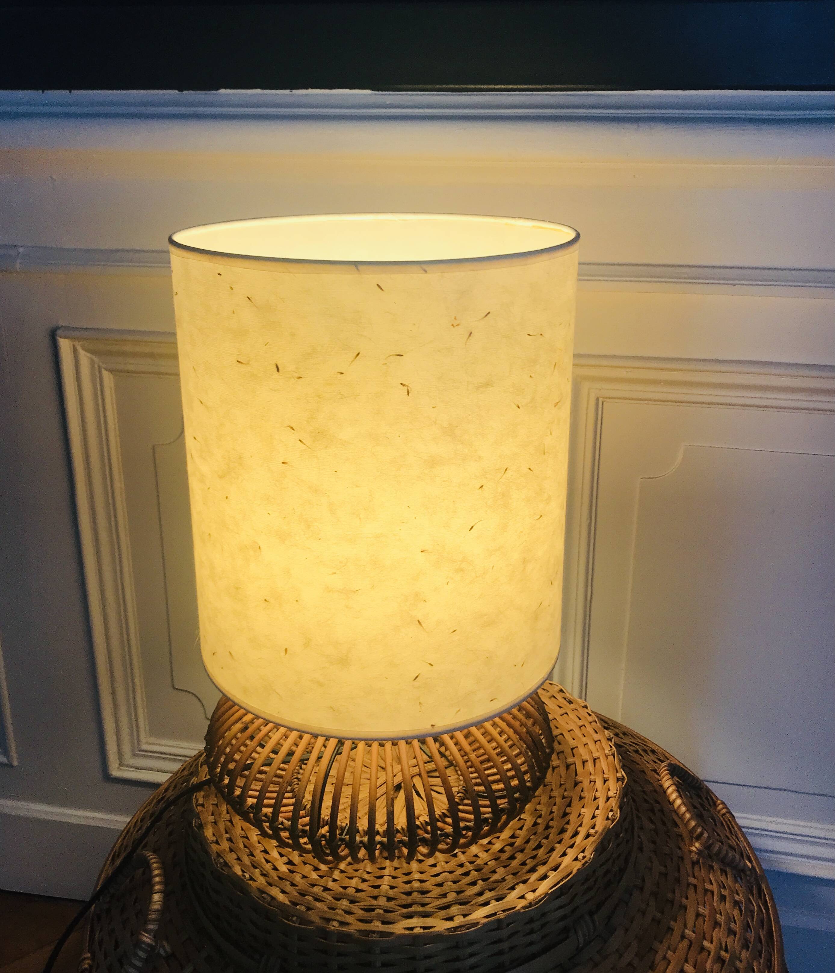 Table lamp with rattan base and papier-mâché hat