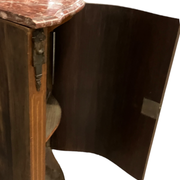Louis XVI style corner buffet with marquetry decoration featuring a vase of flowers