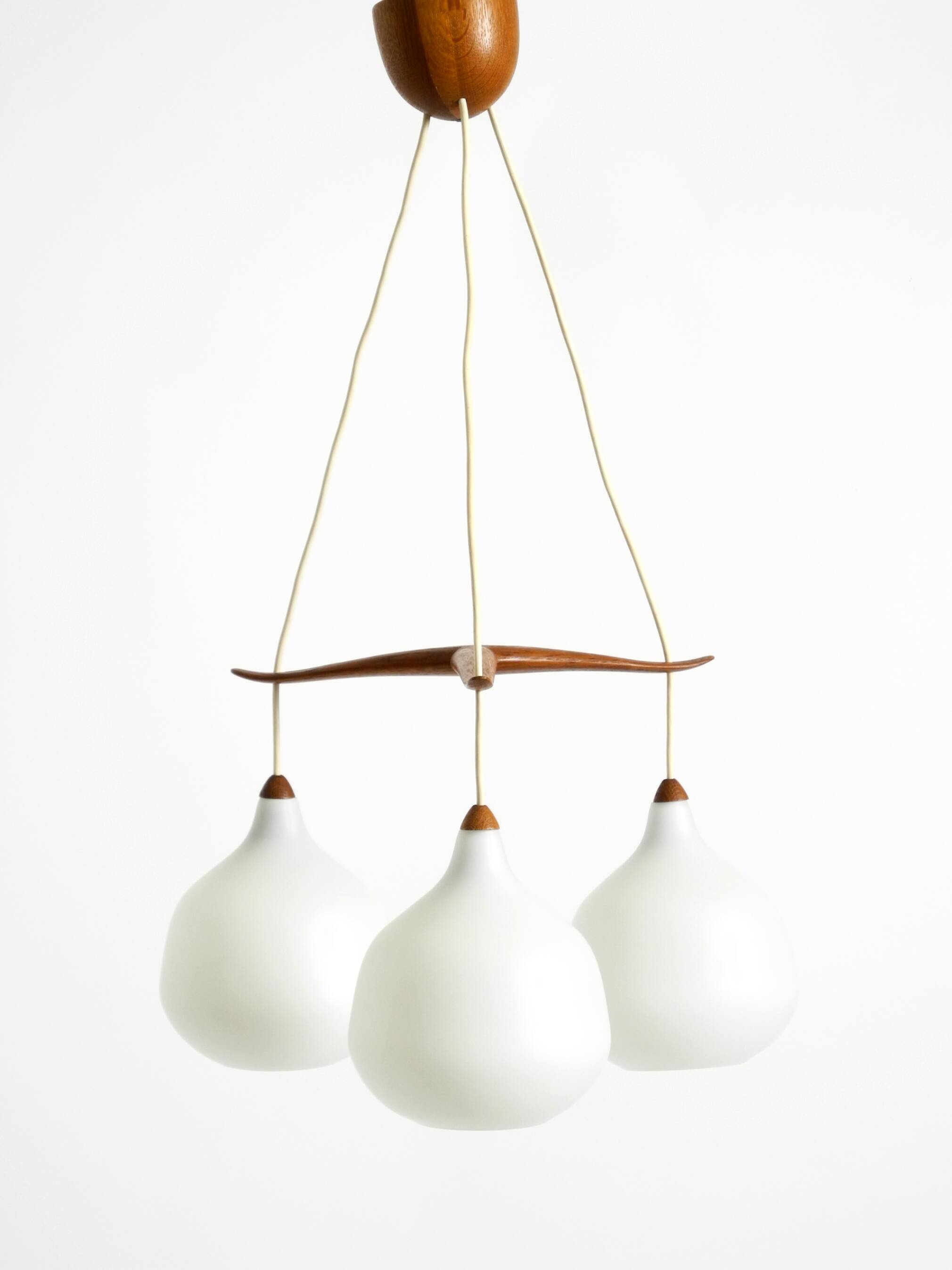 Pendant lamp with opal glass shades teak frame by Uno & Östen Kristiansson