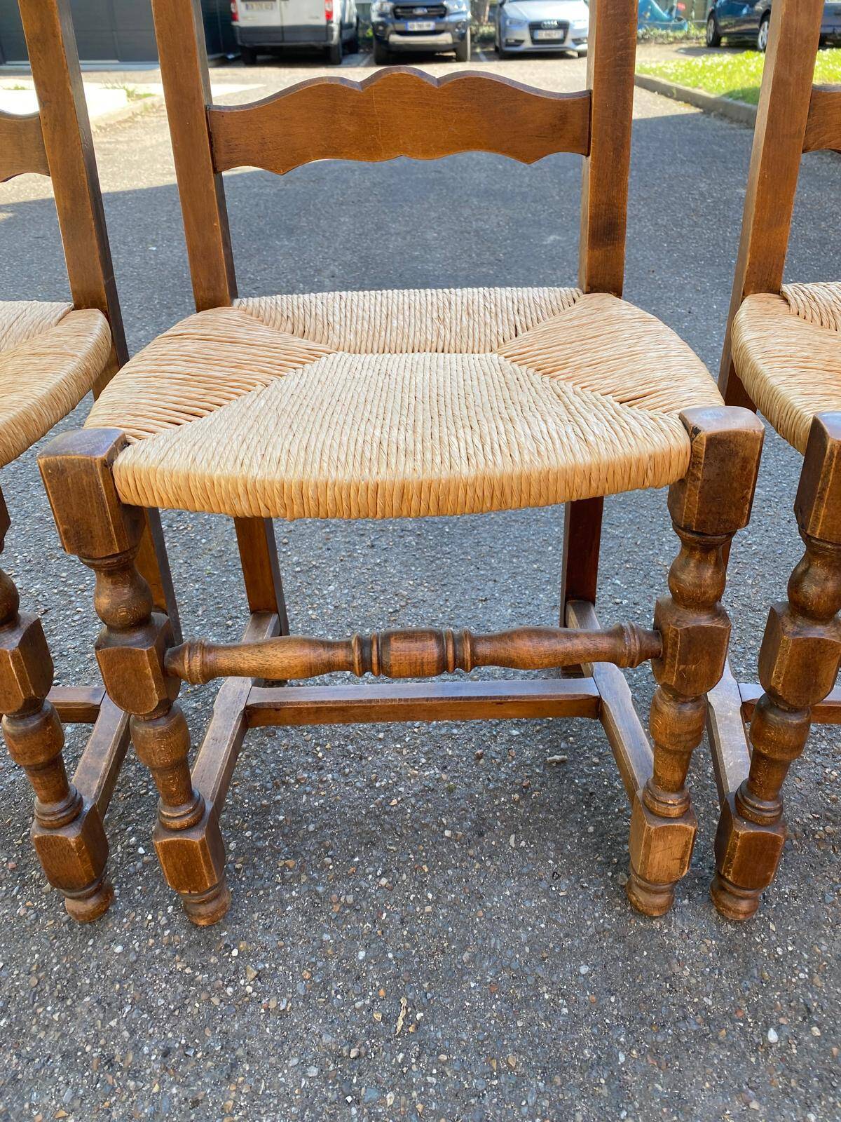 4 or 5 solid wood chairs with light oak straw and high backs
