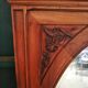 Old oval walnut wood mirror has flower carvings decoration