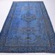 Vintage blue and black Turkish rug with traditional design, 163 × 268 cm