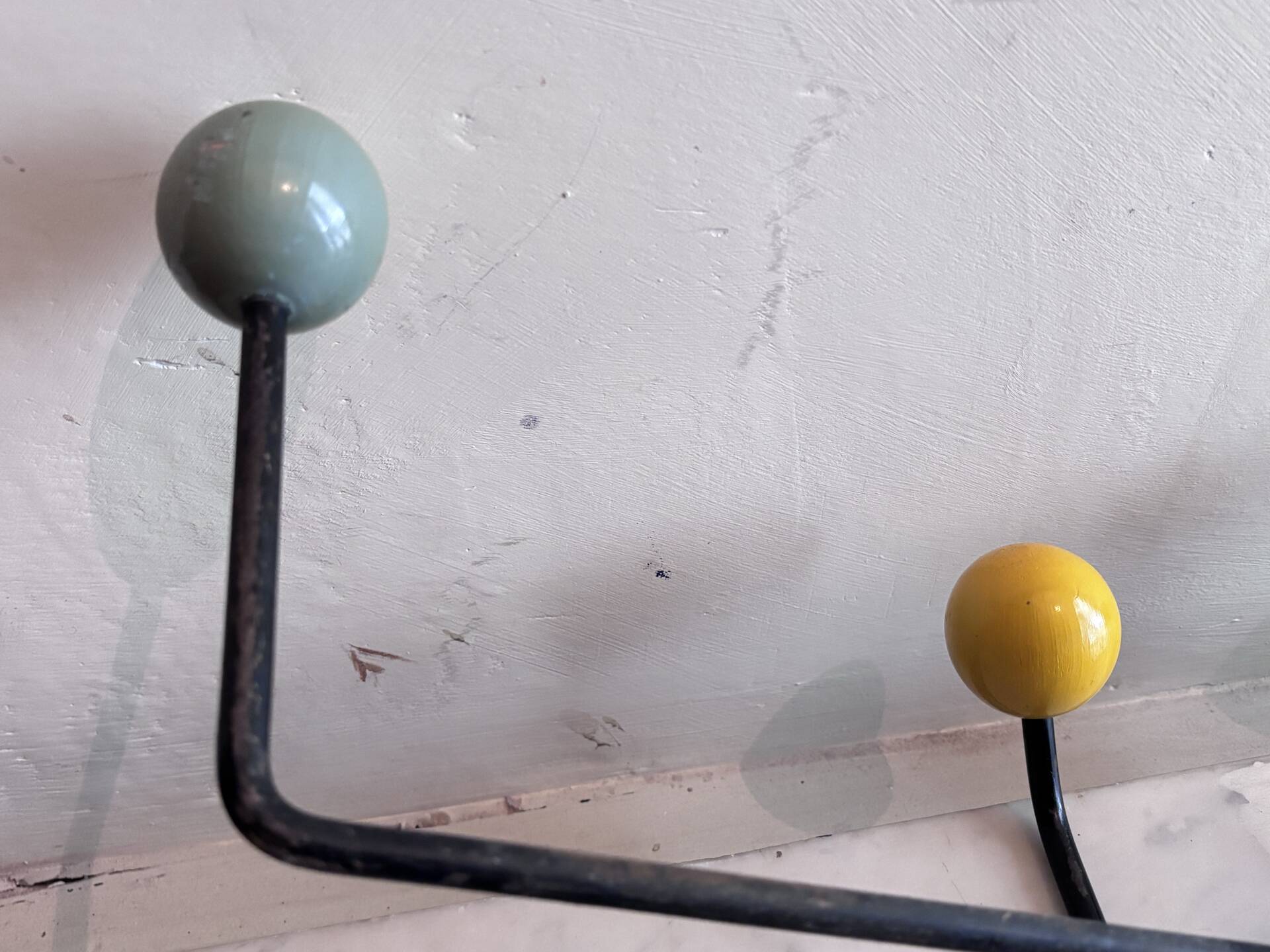 Wall coat rack Roger Feraud, metal and wooden balls.