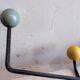 Wall coat rack Roger Feraud, metal and wooden balls.
