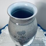 Handcrafted gray stoneware vase with child illustration