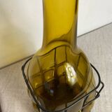 Glass carafe encased in wrought iron
