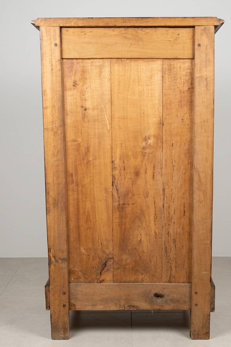 Small storage unit in solid wood and copper.