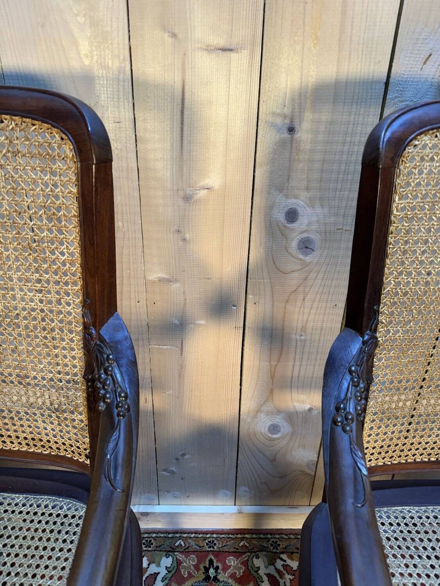 Pair of wide caned armchairs from the Art Nouveau period.