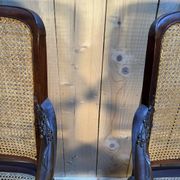 Pair of wide caned armchairs from the Art Nouveau period.