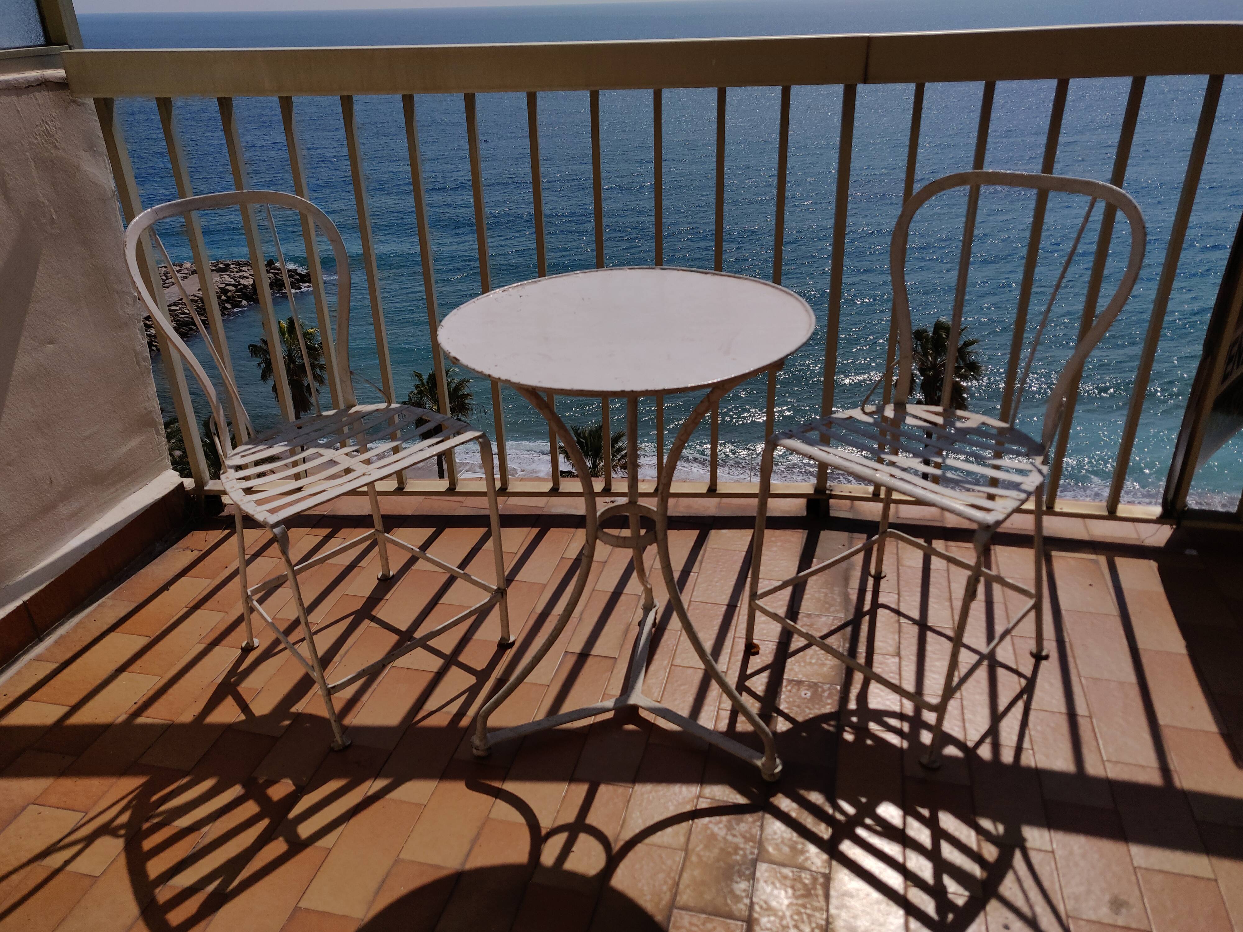 Table and bistro chairs wrought iron terrace