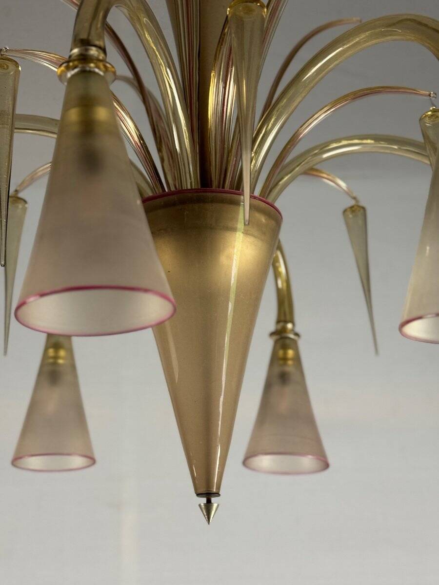 Venetian chandelier in beige/gray murano glass bordered with a red net