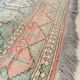 Afghan rug in pastel colors