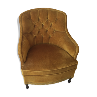 Fauteuil vintage capitonné en velours or