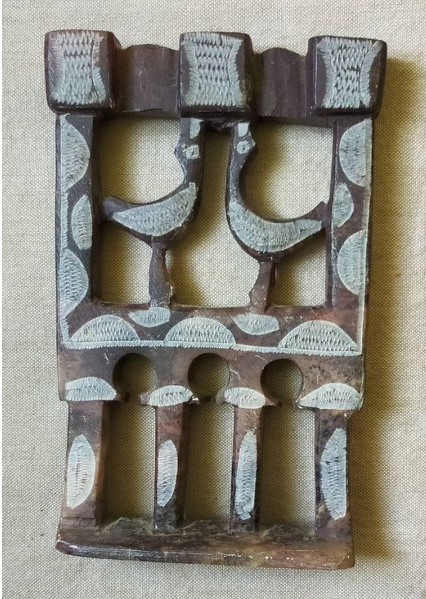 Three-branched stone candlestick adorned with birds, North Africa