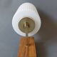 1960 wall light in gilded brass and rosewood.