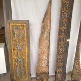 Rectangular Indonesian construction element with blue and yellow plant in carved wood