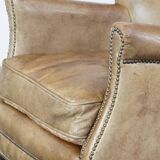 Fauteuil en cuir subtil avec coussin d'assise réversible en kilim