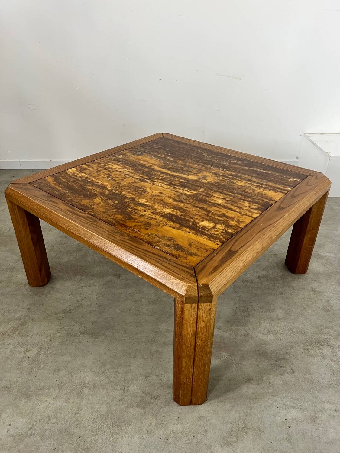 Old coffee table with golden marble top, 70s design, vintage wooden feet