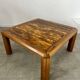 Old coffee table with golden marble top, 70s design, vintage wooden feet