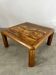 Old coffee table with golden marble top, 70s design, vintage wooden feet