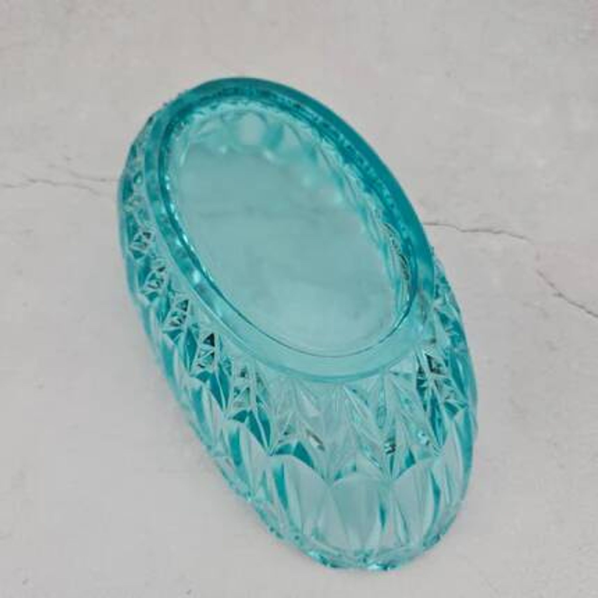Vintage blue-green turquoise plate in cut and relief glass.