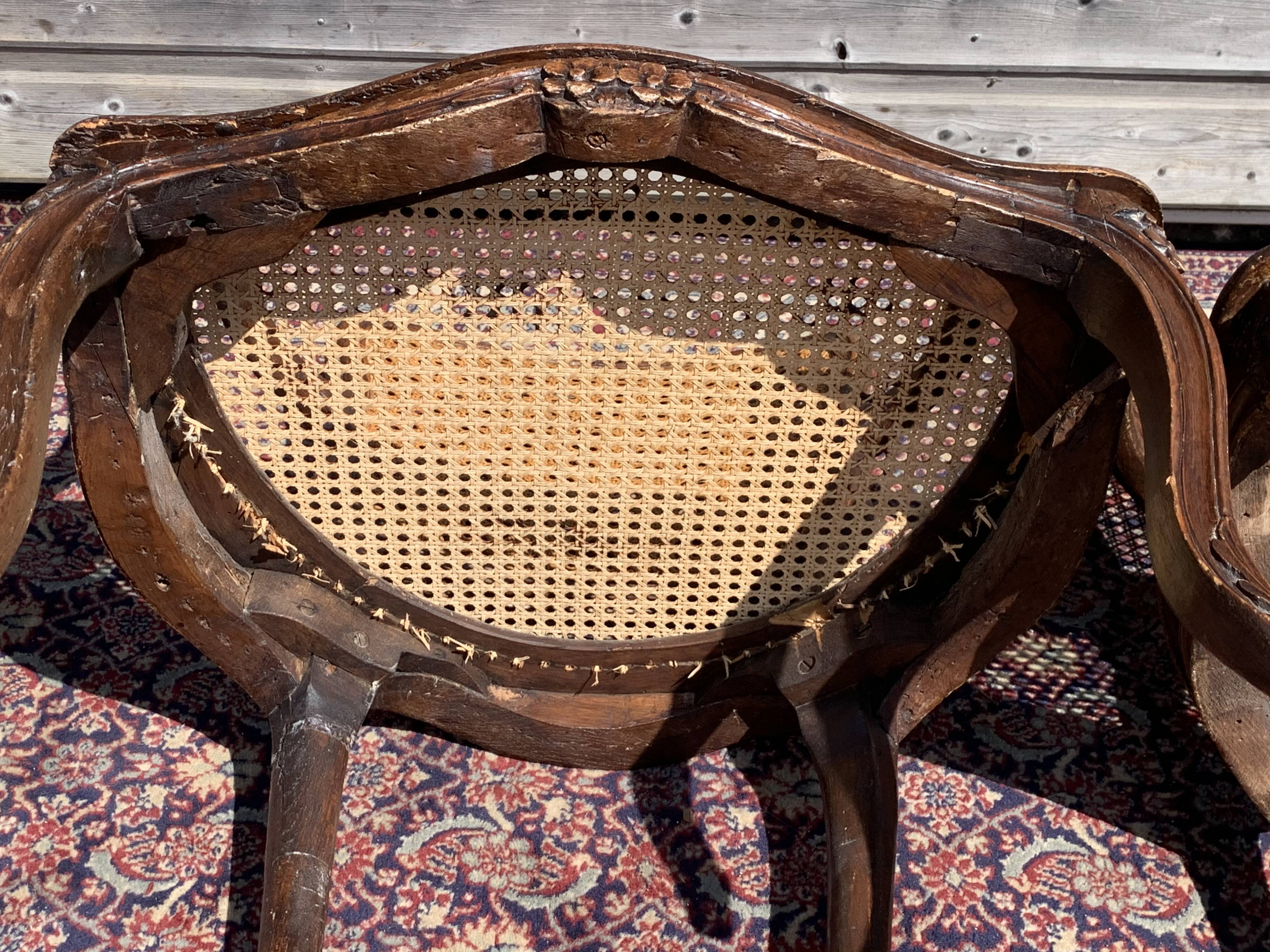 Pair of caned convertible armchairs Louis XV period