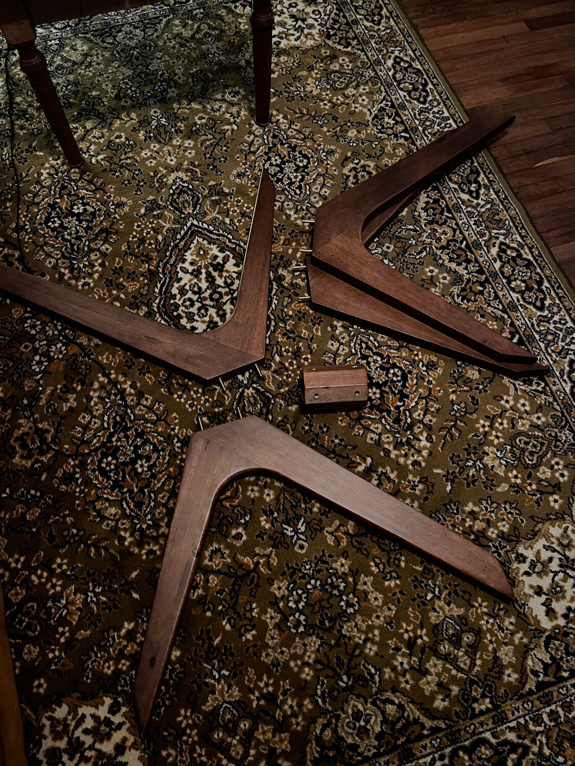 Round table made of solid wood with a walnut finish top.