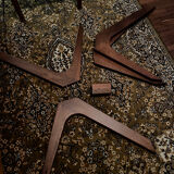 Round table made of solid wood with a walnut finish top.