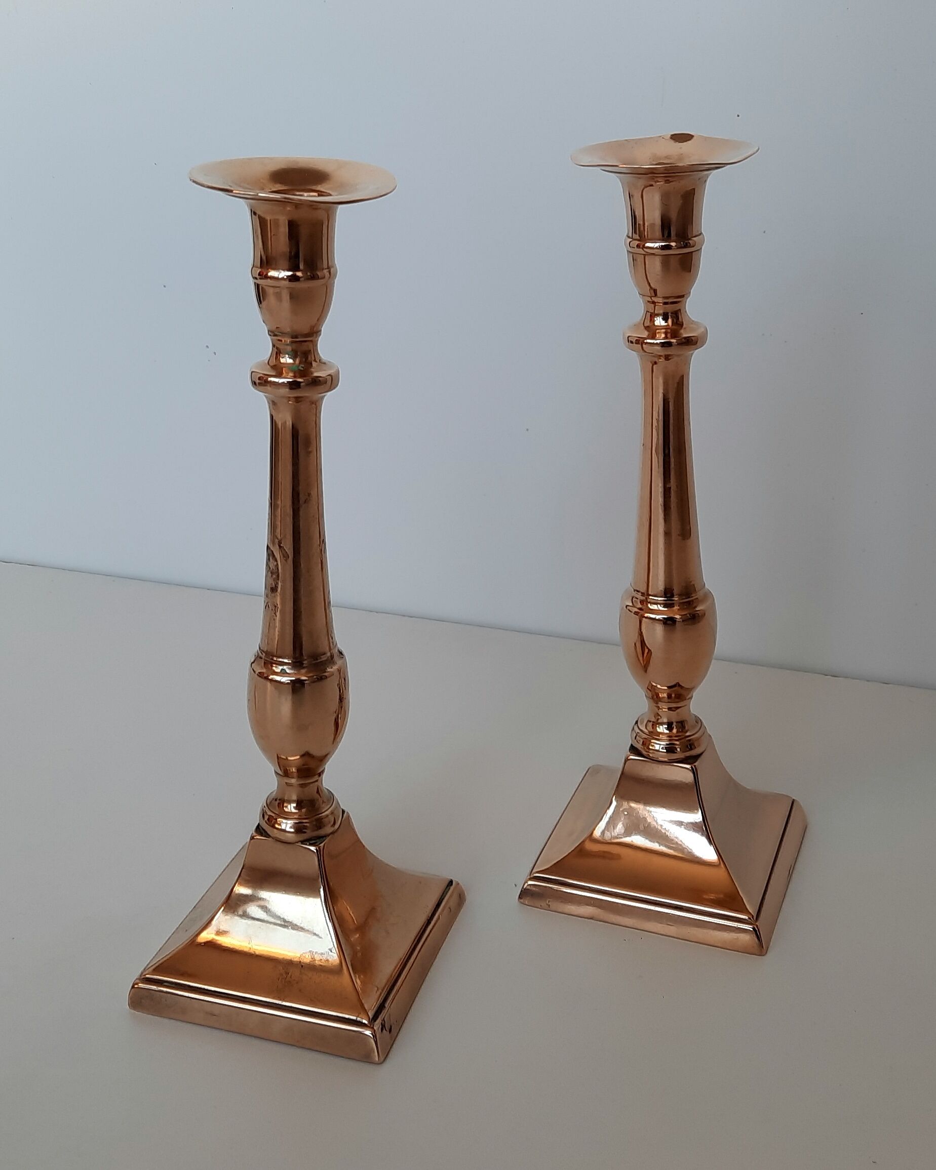 Pair of square foot copper candle holders