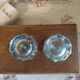 Antique salt and pepper shakers in crystal and silver metal.