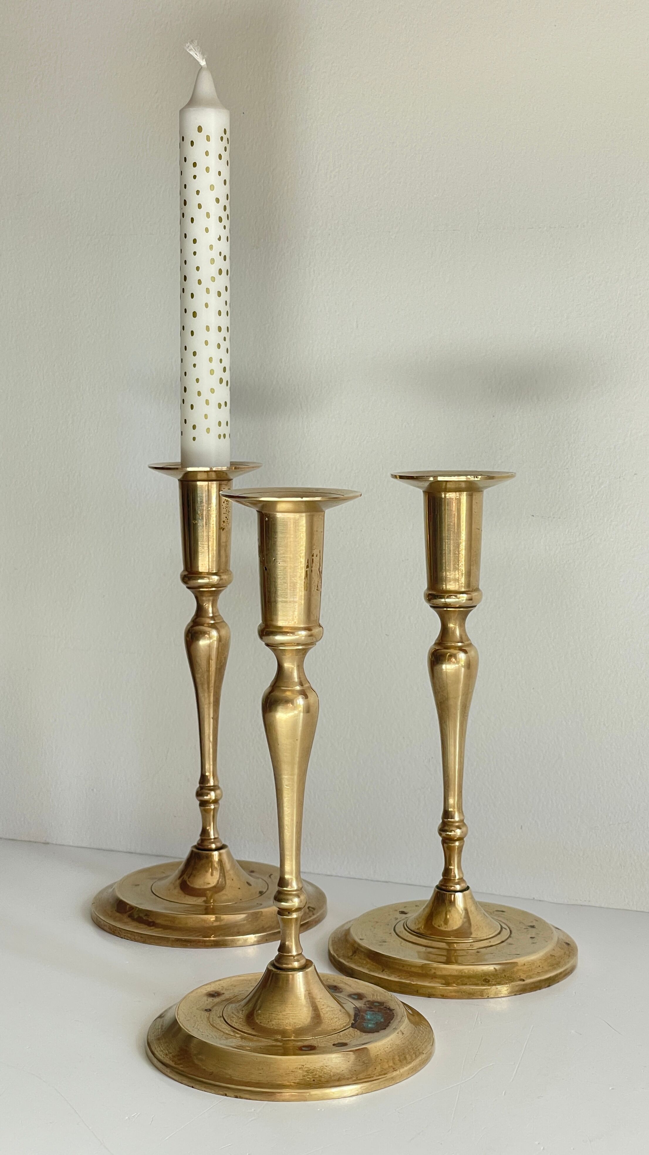 3 patinated brass candle holders