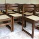 Set of 12 "sledge" dining chairs in walnut and cane.