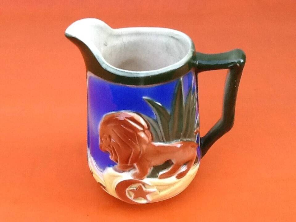 Pichet barbotine decorated with a lion, St-Clément Manufacture, France.