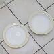 White and yellow porcelain dinner service with gold edging, Poral Limoges France