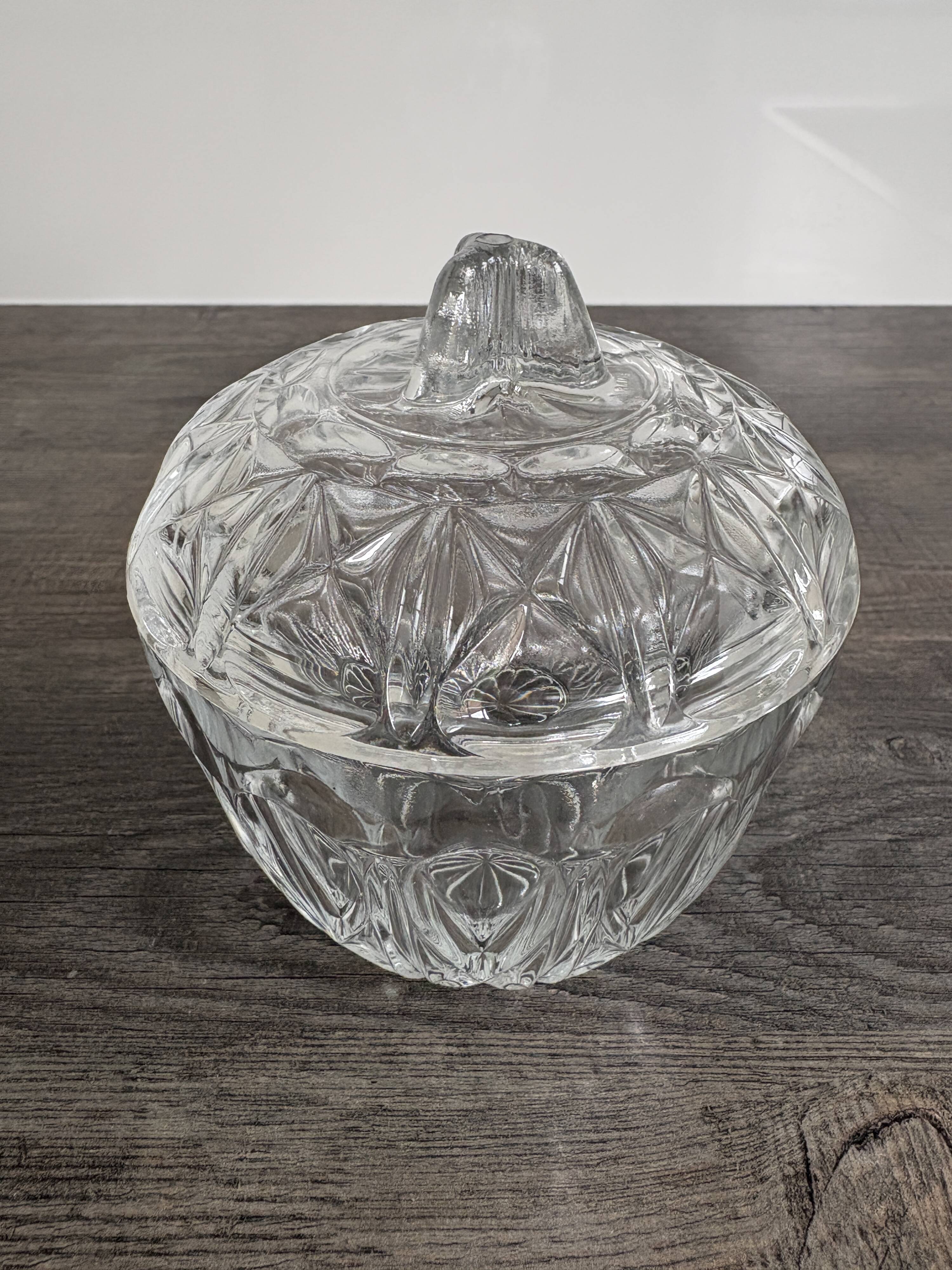 Antique covered jar in chiseled glass