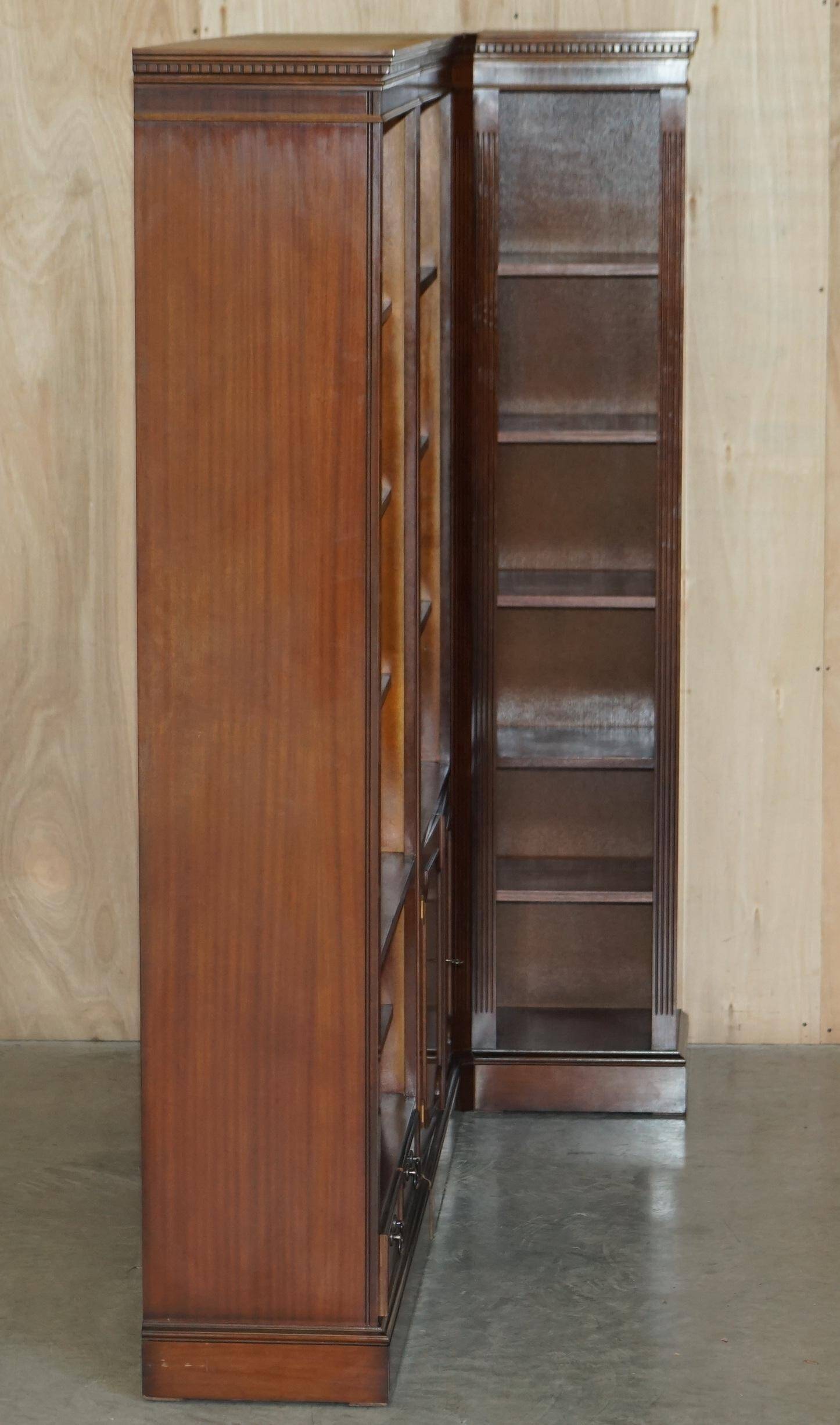 Corner library made of flamed hardwood, in 3 parts.