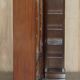Corner library made of flamed hardwood, in 3 parts.