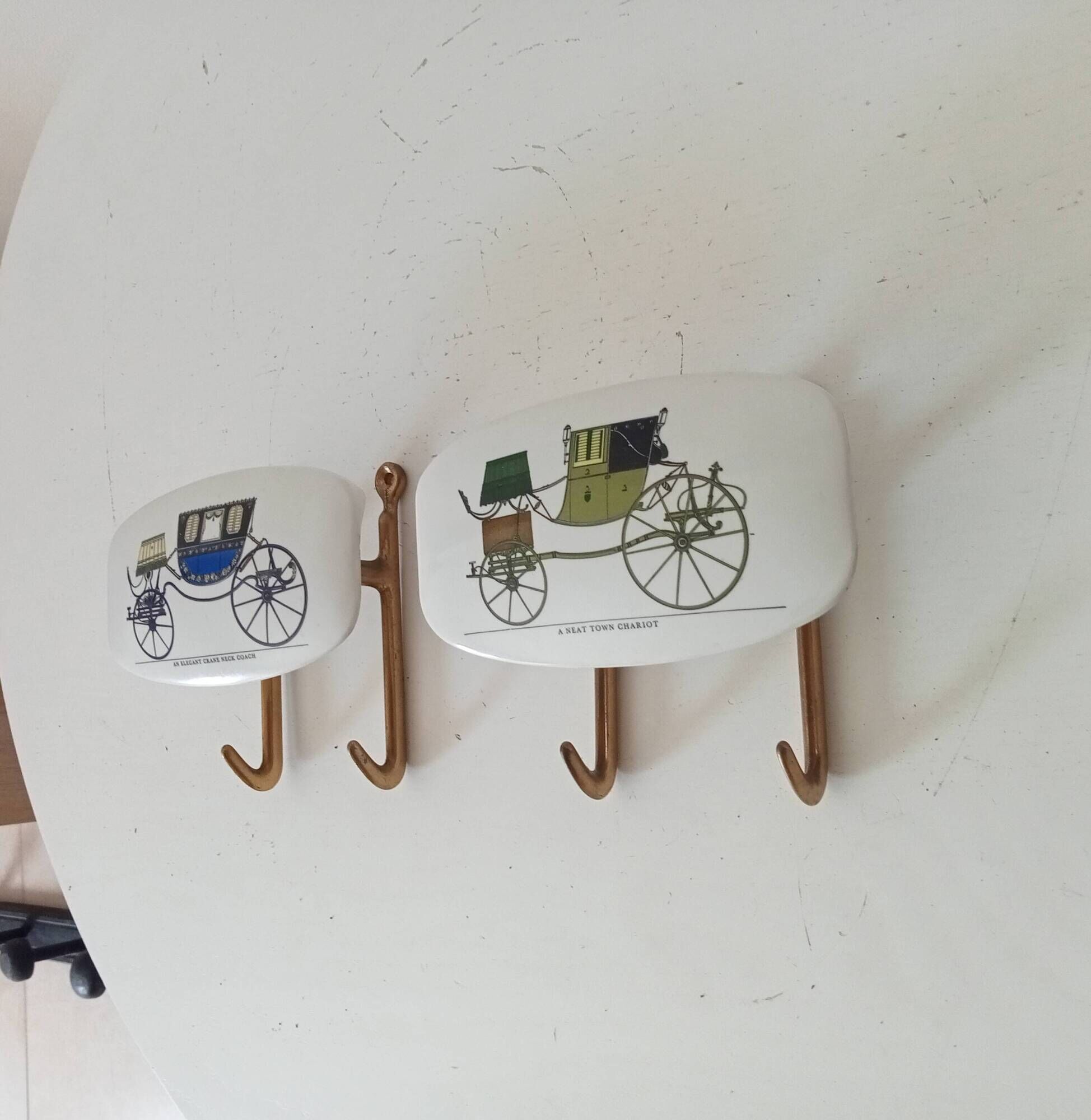 Set of 2 wall coat hooks in Bakelite and brass from the 1950s/60s.