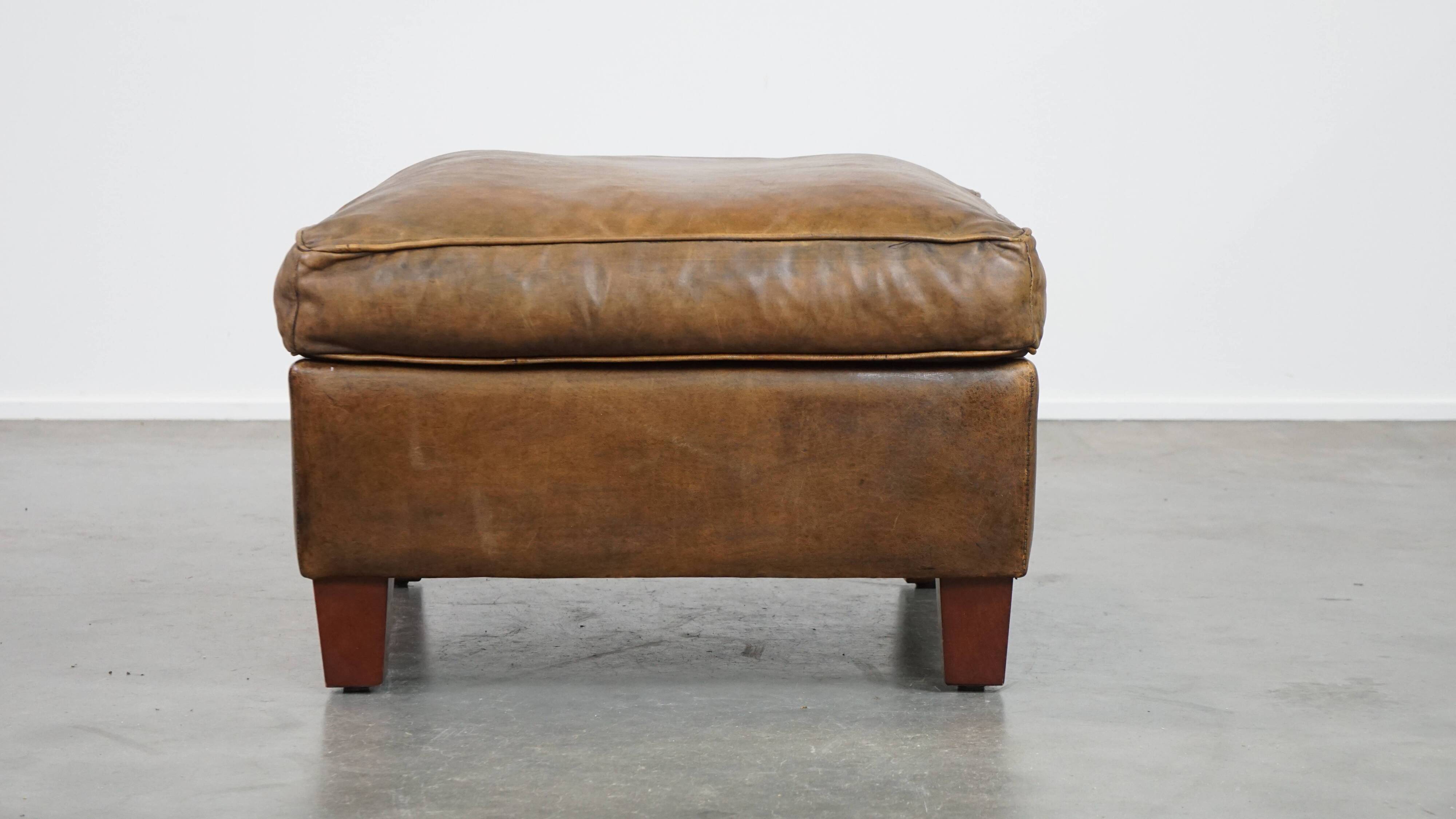 Sheepskin wing chair + XXL patinated footrest