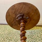 Carved wooden pedestal table