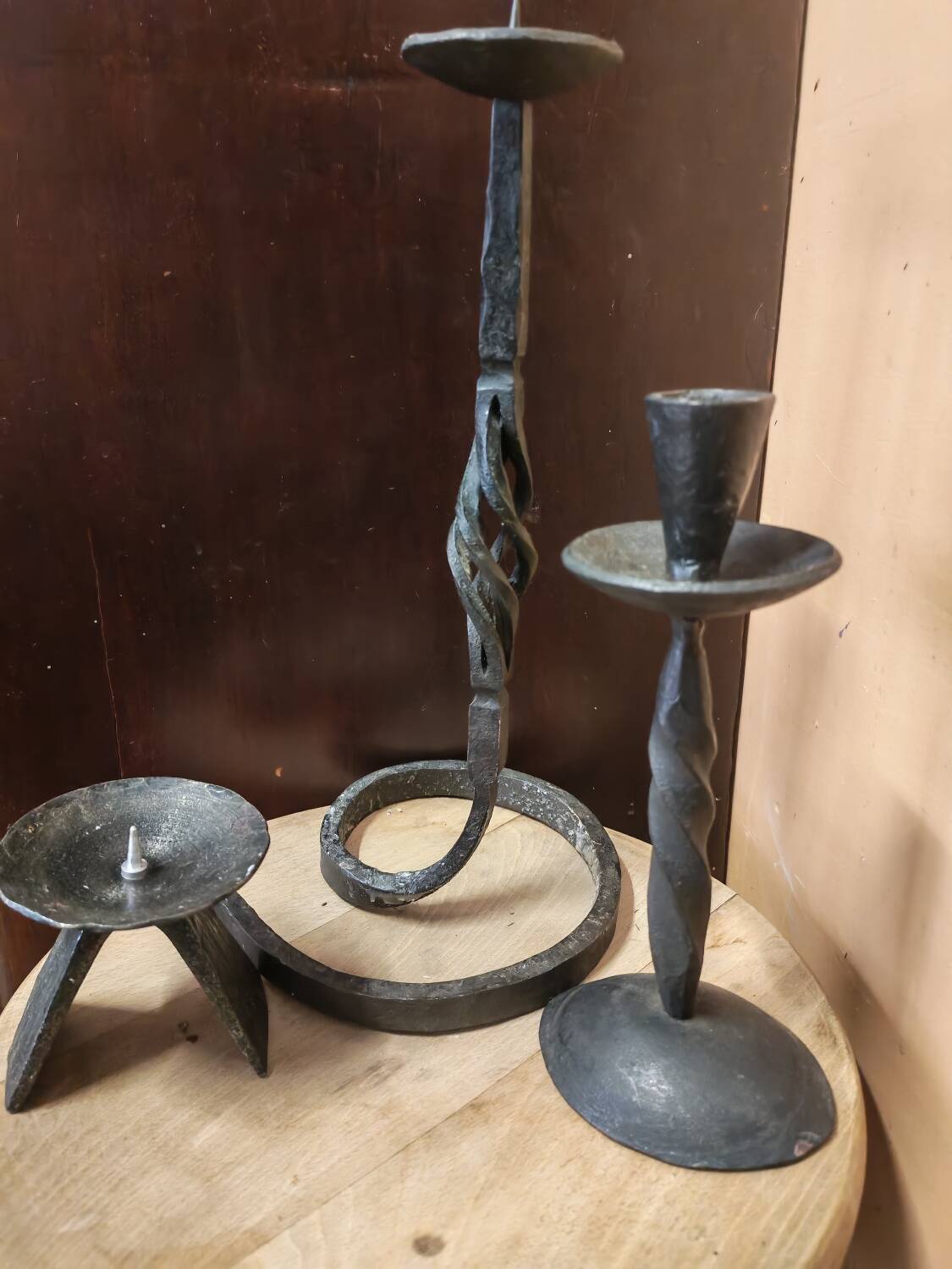Set of 3 candlesticks and a candle holder in wrought iron.
