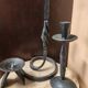 Set of 3 candlesticks and a candle holder in wrought iron.