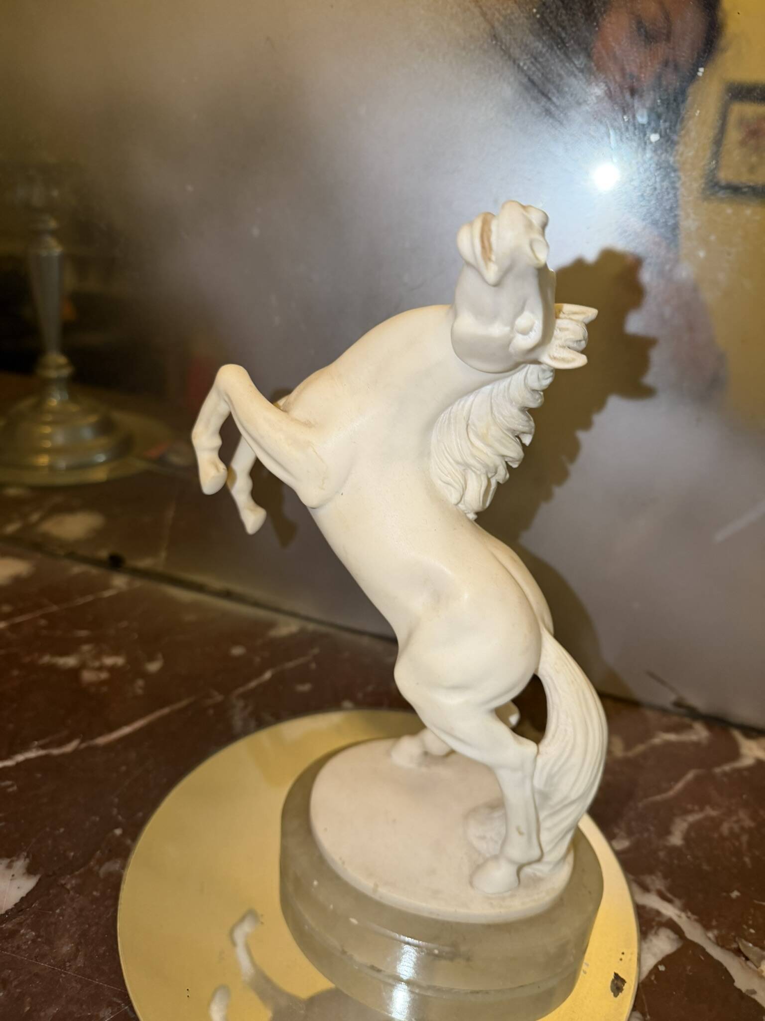 White rearing horse statuette