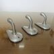 Series of 3 "streamline" aluminum coat hooks from the 60s and 70s