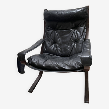 Siesta armchair and footstool in leather and mahogany wood