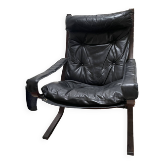 Siesta armchair and footstool in leather and mahogany wood