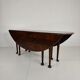Antique English drop-leaf dining table – Victorian – 8 legs – oval shape – seats 8