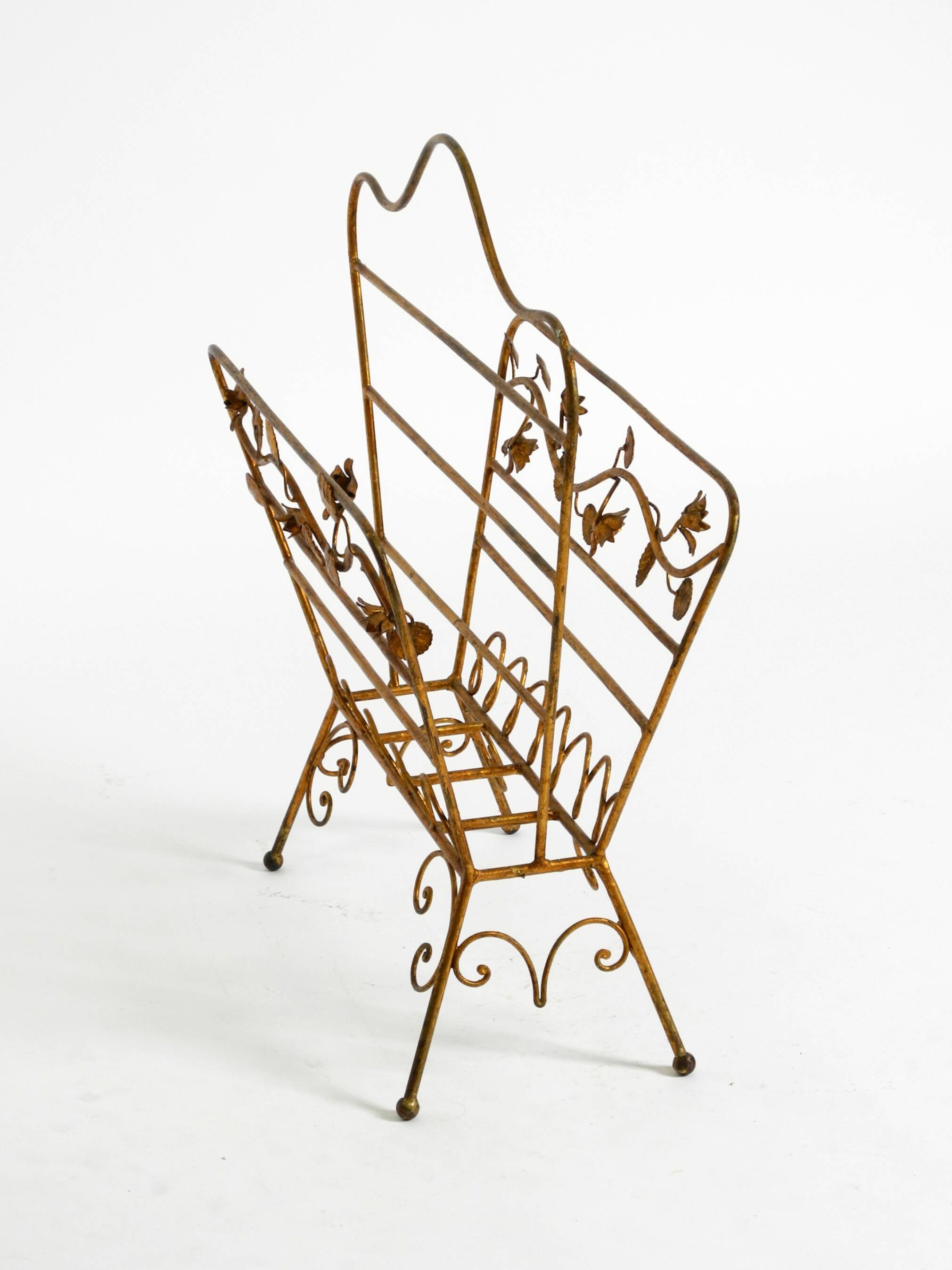 Extraordinary mid-century newspaper and magazine rack with a gilded metal
